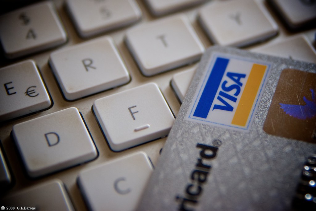 Credit card resting on a computer keyboard